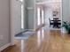 Inviting foyer features hardwood floors that seamlessly transition into the adjacent dining area with beautiful light fixture at 21 Devin Lane Ln, Euharlee, GA 30145