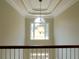 Foyer featuring tray ceiling, pendant light, and a large window overlooking the front yard at 21 Devin Lane Ln, Euharlee, GA 30145