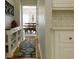 Hallway leads to a dining area with a chandelier, complemented by wood floors at 21 Devin Lane Ln, Euharlee, GA 30145