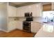 Updated kitchen features stainless steel appliances and white cabinets with subway tile backsplash at 21 Devin Lane Ln, Euharlee, GA 30145