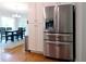 Kitchen with stainless steel refrigerator and view into breakfast room with table and chairs at 21 Devin Lane Ln, Euharlee, GA 30145