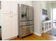 Stainless steel refrigerator with white cabinets and hardwood floors in the kitchen at 21 Devin Lane Ln, Euharlee, GA 30145