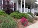 Up-close view of mature landscape bordering the front of this charming two-story home at 21 Devin Lane Ln, Euharlee, GA 30145