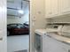Convenient laundry area with washer, dryer, and a glimpse into the garage at 21 Devin Lane Ln, Euharlee, GA 30145