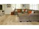Comfortable living room features a plush sofa, ottoman, and bright windows at 21 Devin Lane Ln, Euharlee, GA 30145