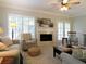Comfortable living room with a fireplace, neutral decor, and plenty of natural light through shuttered windows at 21 Devin Lane Ln, Euharlee, GA 30145