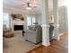 Cozy living room with fireplace, plush seating, and natural light streaming through shuttered windows at 21 Devin Lane Ln, Euharlee, GA 30145