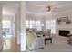 Bright and airy living room with large windows, a fireplace, and hardwood floors flowing into an adjacent seating area at 21 Devin Lane Ln, Euharlee, GA 30145