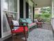 Cozy front porch setup with rocking chairs, a bench and an outdoor rug for relaxing at 21 Devin Lane Ln, Euharlee, GA 30145
