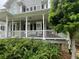Inviting front porch featuring comfortable seating and views of the lush surrounding landscape at 21 Devin Lane Ln, Euharlee, GA 30145