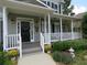 Charming front porch with tastefully designed doorway and lush landscape at 21 Devin Lane Ln, Euharlee, GA 30145