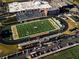 An aerial view of Buford High School's football field, track, bleachers, and parking lot at 3642 S Bogan Rd, Buford, GA 30519