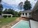 Spacious backyard features a hot tub, small deck, and a grassy area at 3642 S Bogan Rd, Buford, GA 30519