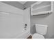 Bright bathroom featuring a tub with white subway tile surround and built-in shelving niche at 3642 S Bogan Rd, Buford, GA 30519