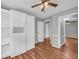 Bedroom with wood flooring and a built-in bookcase at 3642 S Bogan Rd, Buford, GA 30519