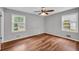 Bedroom features two windows and a ceiling fan at 3642 S Bogan Rd, Buford, GA 30519