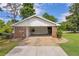 Ranch style home featuring carport, well-maintained lawn, and charming curb appeal at 3642 S Bogan Rd, Buford, GA 30519