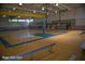 An indoor gymnasium with a shiny wooden floor and basketball hoops at 3642 S Bogan Rd, Buford, GA 30519