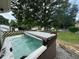 Relaxing hot tub with cover in a backyard setting at 3642 S Bogan Rd, Buford, GA 30519