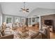 Spacious living room with large windows and comfortable seating area at 3642 S Bogan Rd, Buford, GA 30519