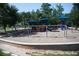 A public playground with slides, swings, and other play equipment at 3642 S Bogan Rd, Buford, GA 30519