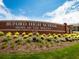 Beautiful view of Buford High School featuring well-maintained landscaping and brick facade at 3642 S Bogan Rd, Buford, GA 30519