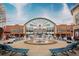 A vibrant shopping center featuring a central fountain and a variety of retail outlets for leisure and convenience at 3642 S Bogan Rd, Buford, GA 30519