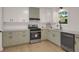 Well-equipped kitchen features sleek appliances, attractive cabinets, and modern fixtures at 589 Wilmont Dr, Jonesboro, GA 30238