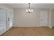 Spacious living area featuring beautiful hardwood floors, neutral walls, and a lot of natural light at 589 Wilmont Dr, Jonesboro, GA 30238