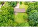Aerial view of the house nestled among lush greenery, surrounded by tall trees at 100 Eldorado Dr, Carrollton, GA 30116