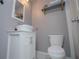 Well-lit bathroom with modern sink, vanity, and convenient toilet location at 100 Eldorado Dr, Carrollton, GA 30116