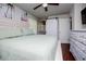 Bright bedroom with a barn door, closet, ceiling fan and a charming aesthetic at 100 Eldorado Dr, Carrollton, GA 30116