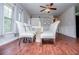 Bright dining area with wood floors, modern decor, and a ceiling fan provides a great space for meals at 100 Eldorado Dr, Carrollton, GA 30116