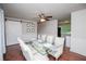Bright dining area with wood floors, modern decor, and a ceiling fan provides a great space for meals at 100 Eldorado Dr, Carrollton, GA 30116