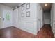 Bright foyer with wood floors, decorative trim, barn door, and ample natural light creates an inviting entrance at 100 Eldorado Dr, Carrollton, GA 30116