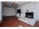 Living room with stone fireplace and entertainment center at 100 Eldorado Dr, Carrollton, GA 30116