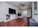 Living room with stone fireplace and entertainment center at 100 Eldorado Dr, Carrollton, GA 30116