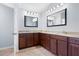 Bathroom with granite countertops, dual sinks, and ample cabinet space for storage at 130 Bevington Ln, Woodstock, GA 30188