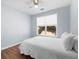 Light and bright bedroom with a ceiling fan and a window to the backyard at 130 Bevington Ln, Woodstock, GA 30188