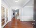 Spacious foyer featuring hardwood floors, natural light, and access to the staircase and french doors at 130 Bevington Ln, Woodstock, GA 30188