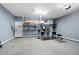 Spacious garage with high ceilings, overhead storage racks, and ample workspace at 130 Bevington Ln, Woodstock, GA 30188
