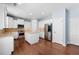 Bright kitchen with stainless steel appliances, island, and ample cabinet space at 130 Bevington Ln, Woodstock, GA 30188