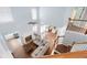 Aerial view of a bright living room with hardwood floors and stairs in the background at 130 Bevington Ln, Woodstock, GA 30188