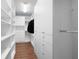 Spacious walk-in closet with custom shelving and ample storage, providing organization and convenience at 130 Bevington Ln, Woodstock, GA 30188