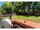 The home has a well-maintained backyard with a barbecue grill, perfect for outdoor activities and entertainment at 169 Wallnut Hall Circle, Woodstock, GA 30189