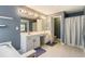 Bathroom featuring a vanity with double sinks and a tub with shower at 169 Wallnut Hall Circle, Woodstock, GA 30189