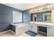Bathroom featuring a vanity, a soaking tub, and stylish finishes at 169 Wallnut Hall Circle, Woodstock, GA 30189