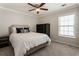 Bedroom with a ceiling fan, window and storage at 169 Wallnut Hall Circle, Woodstock, GA 30189