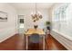 Inviting dining room featuring hardwood floors, neutral walls, and view of the backyard at 169 Wallnut Hall Circle, Woodstock, GA 30189