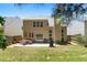 The back of the house features a patio, a backyard, and sliding glass doors to the exterior at 169 Wallnut Hall Circle, Woodstock, GA 30189